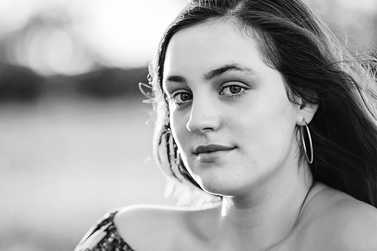 teenage girl dressed up for her high school formal by deb elton photography